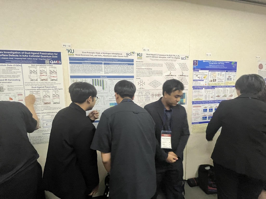 Researchers discussing posters at ACCMS-11